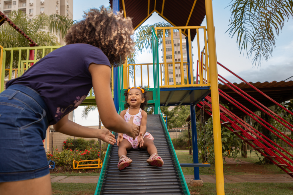 mother and child on slide