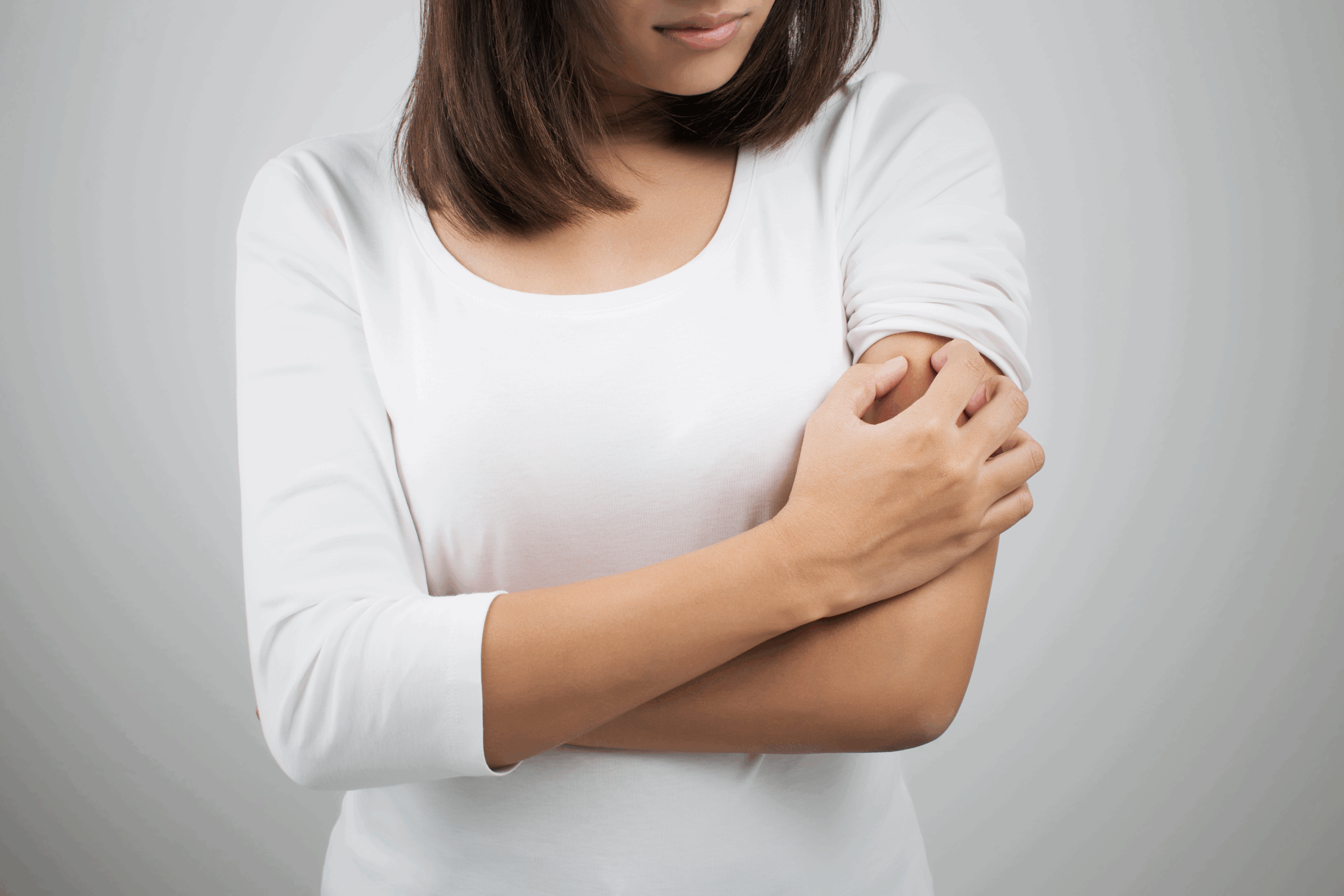 woman scratching bite