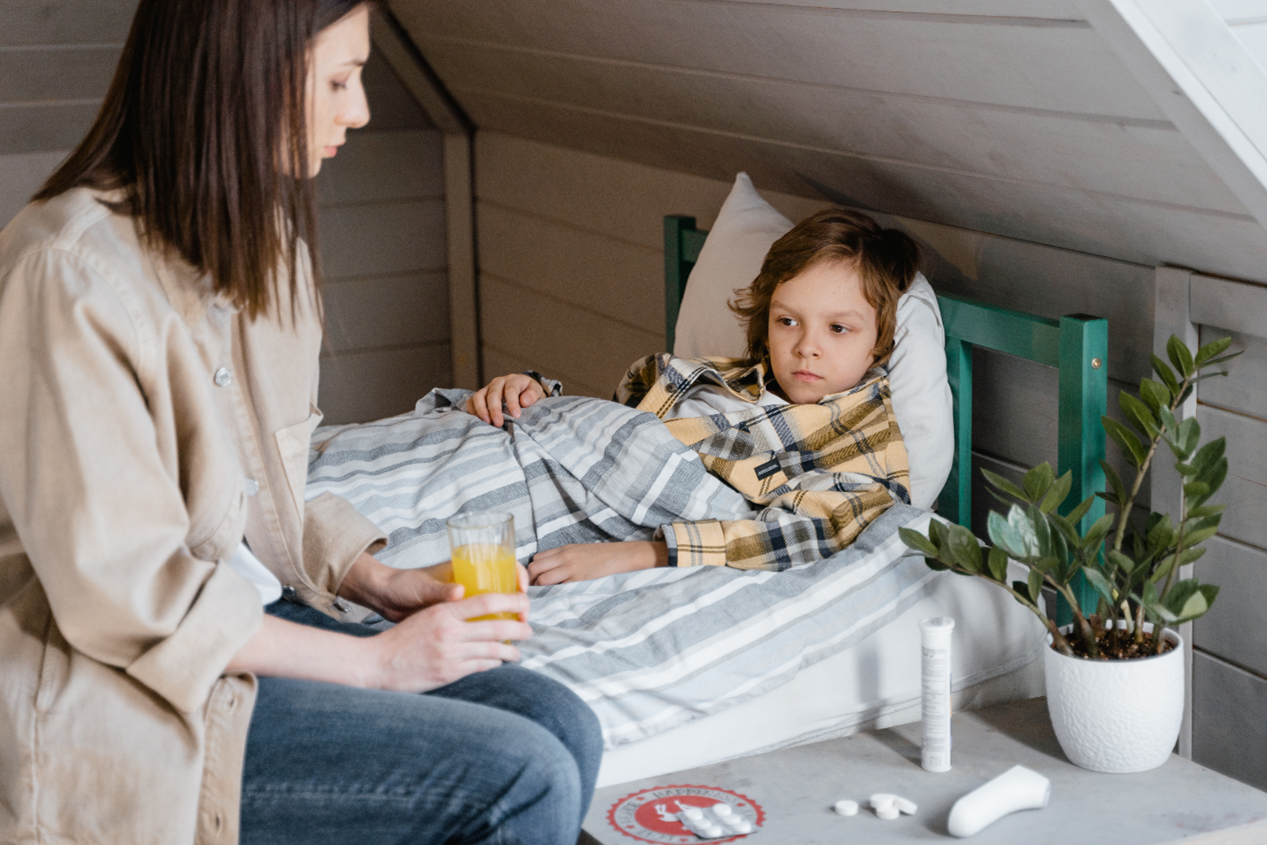 mom checking on her sick child